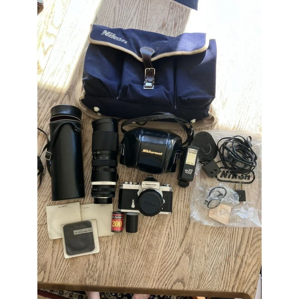 Nikon Nikkormat FTN 35 mm Camera with Additional lens, leather cases, & extras